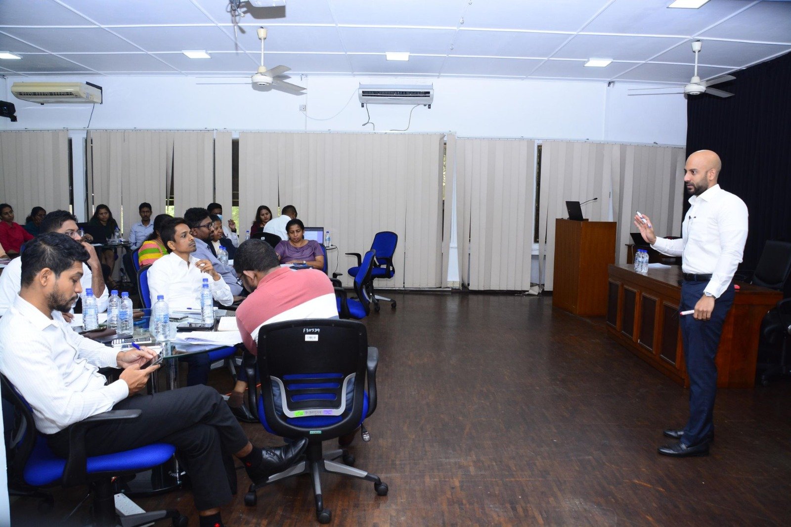 Salman Faiz conducting a corporate finance training workshop for professionals in Colombo